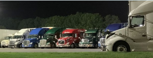 Full parking lot of freight trucks