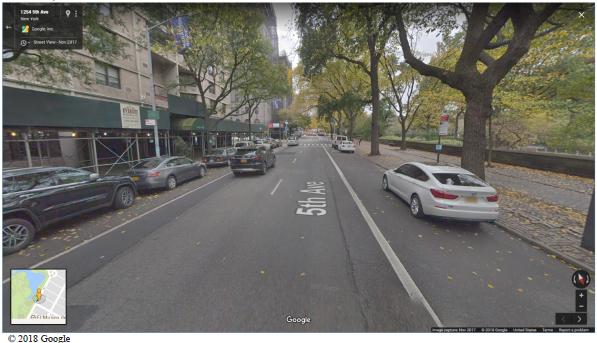 Google maps view of a street looking along the direction of travel. The roadway has an overlay indicating it is 5th Ave. Copyright 2018 Google.