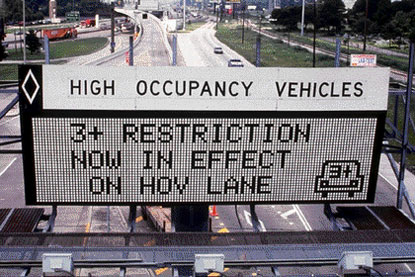 photo of dynamic message sign indicating the current occupancy restriction in effect