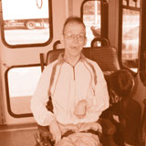 man in wheelchair in paratransit vehicle