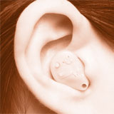 Close-up of a hearing aid in an ear