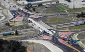 Photograph. An aerial view of the I-44/Route 13 diamond interchange.