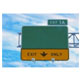 Photograph. A freeway exit ramp sign (exit only) represents “freeway exit ramps.”