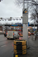 Photo of roadways with toll gantries, representing entrance/exit points in an area with cordon-pricing.