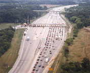 One of three images, representing traditional tolling options.  Photo of a toll plaza on a highway.