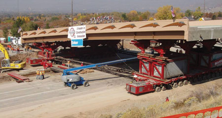 Utah: The photograph shows the superstructure moving with the aid of using self-propelled modular transporters (SPMTs) during an accelerated bridge construction project.