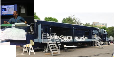 The MA state police mobile incident command center and an officer working inside the command center.