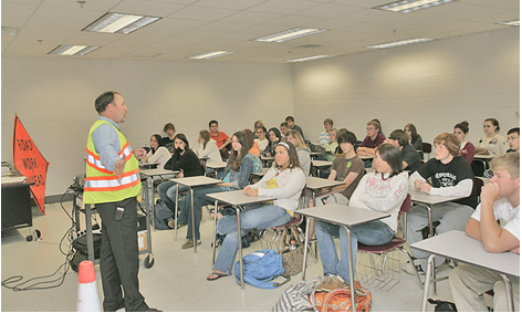 A VDOT staffer speaking to a classroom of students.