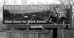 highway sign "Watch for DOT's New Colors. Slow Down for Work Zones!"