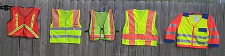 Flourescent colored worker vests with various patterns