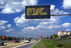 Figure 2-1 VMS Near Disney, Orlando Florida: an overhead Variable Message Sign displays the message: Next 5 Miles, All Lanes Clear