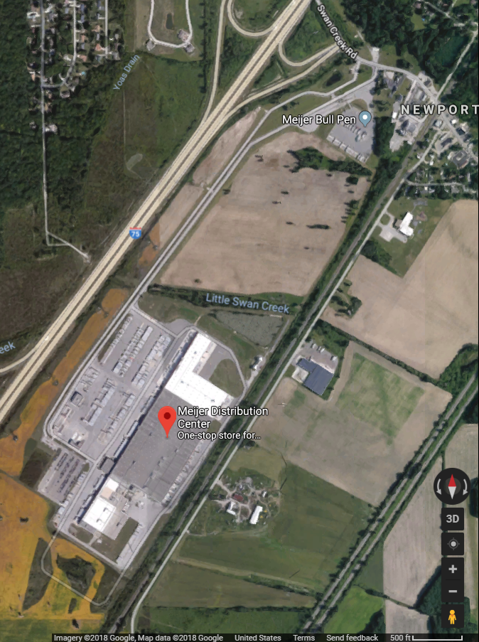 Aerial photo of truck parking at a Meijer Grocery Stores distribution center bullpen in Newport, MI, labeled to show the distribution center and the bull pen.