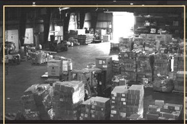 Photograph of many stacks of cargo at air cargo consolidation center at Chicago O'Hare Airport.
