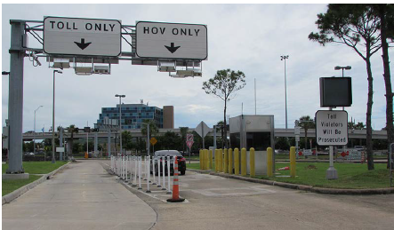 Photo depicts a set of Katy freeway entrances to both the toll only lanes as well as the HOV lanes.