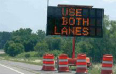 Picture of a portable warning sign used in a dynamic late merge system