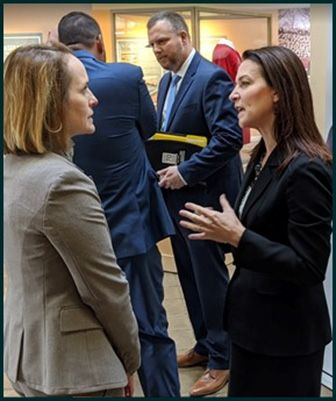 Figure 13 shows Federal Highway Administration Administrator Nicole R. Nason discussing traffic incident management and safety with National Safety Council Representative Jane Terry.