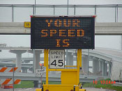 photo of portable message board showing speed of approaching traffic
