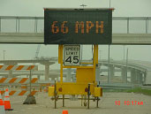 photo of portable message board showing speed of approaching traffic as 66 mph
