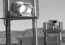 photo of traffic camera and lights next to highway