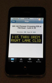 Cell phone depicting a lane closure warning message.