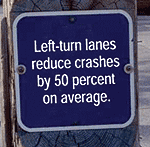 road sign: Left-turn lanes reduce crashes by 50 percent on average