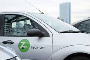 Photo. Closeup of a car in a Zipcar fleet parking location.  Example of an ADM strategy in use – dynamic ridesharing provided by Zipcar.