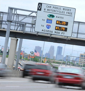 Photo. Signage with dynamically changing tolls above a Minnesota toll lane. Example of an ADM strategy in use – dynamic pricing in Minneapolis, MN.