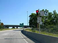 A right-side shoulder-mounted ramp meter and signs