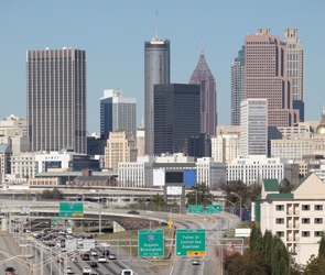 Cover graphic shows a view of Atlanta downtown buildings in the background. Signage in the foreground indicates the off-ramp from the highway leads to Fulton Street and Central Avenue.