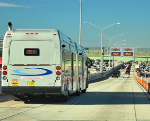 Cover graphic shows a bus in the foreground traveling in one of two lanes designated for toll use, with several passenger vehicles spread out ahead. At the right, several lanes of bumper-to-bumper traffic are shown.