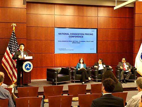 Patrick Vu, at the podium, introducing session panel members