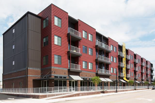 Figure 3. Recent Mixed use Development: image of building with mix of apartments and stores.