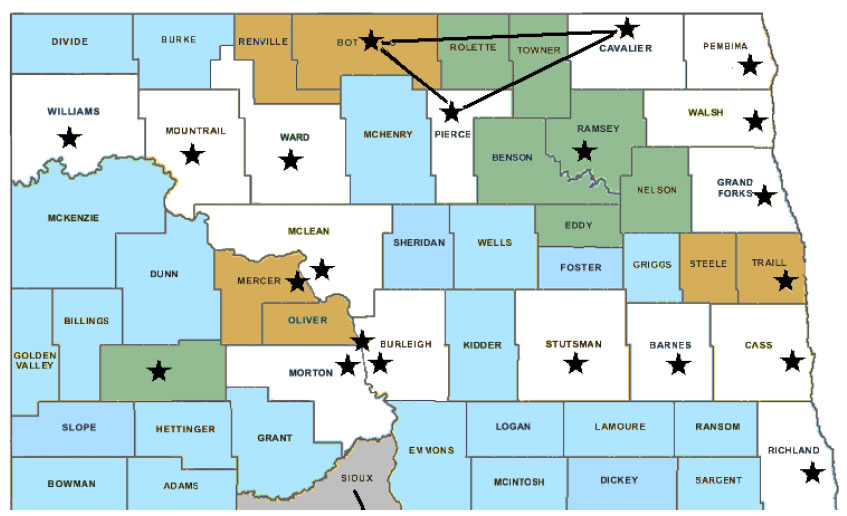 Figure 2 Public Safety Answering Point (PSAP) Sites for Emergency Response Dispatch.  Map of North Dakota with counties identified.  Several countries have a star in them to indicate a PSAP site.