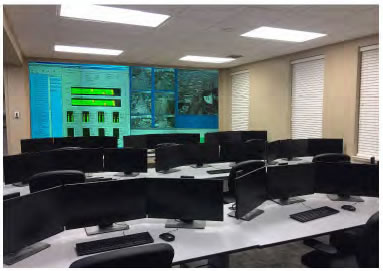 Picture of West Alabama Regional Traffic Management Center showing numerous computer screens and camera views.