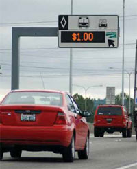 Photo. Overhead sign identifying the current toll for a HOT lane in Seattle.