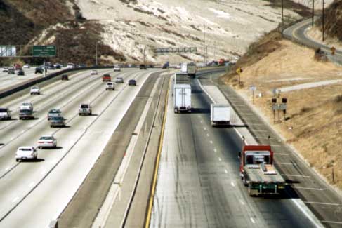 photo of the truck bypass lanes on I-5, consisting of two lanes on the outside and separated from the general purpose lanes by a concrete barrier