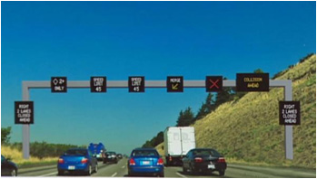figure 22 - photo - Photograph of variable speed limit sign with lane controls in Seattle, WA