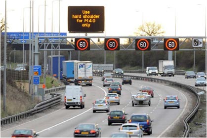 figure 61 - photo - Photograph of variable speed limit and dynamic message sign on M42 Motorway in Manchester, United Kingdom