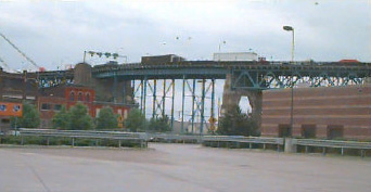 Photo of the Ambassador Bridge, a large, imposing border crossing bridge.
