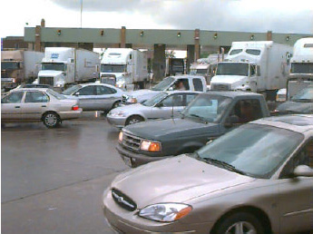 Photo of heavy car and truck traffic exiting the primary collection point at the Ambassador Bridge.