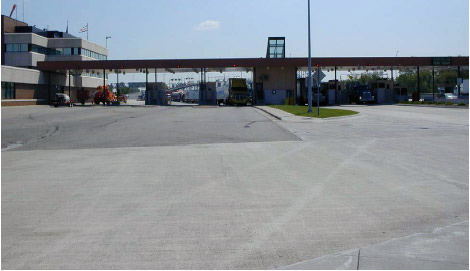 Photo of U.S. Customs primary inspection booths from the IB-2 collection station, showing vehicles entering tollbooths.