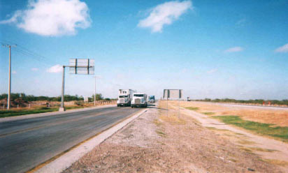 Photo of access road leading to World Trade Bridge, with the bridge in the background.