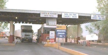 Photo of final Customs station on the Mexican side, showing a truck exiting the checkpoint.