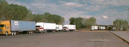 Photo of inbound trucks on the Mexican side between the initial and export checkpoints.