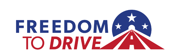 Freedom to Drive logo featuring a red highway with median stripes leading into a blue tunnel with stars