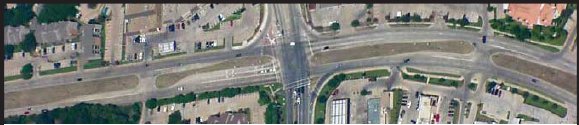 Aerial image showing a median with a left turn lane.