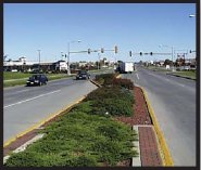 Photograph of a median strip with signalized left turn lane installed.