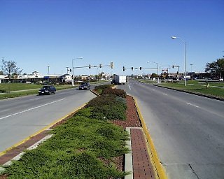 Photograph of a median with a signalized left turn lane.
