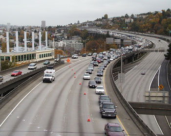 Freeway backup. The picture shows traffic being diverted into one lane on a major freeway in an urban area.