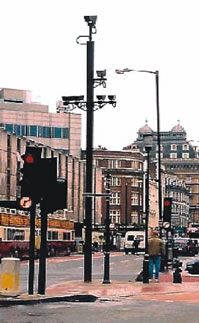 An image showing enforcement cameras in London are installed on existing utility poles.